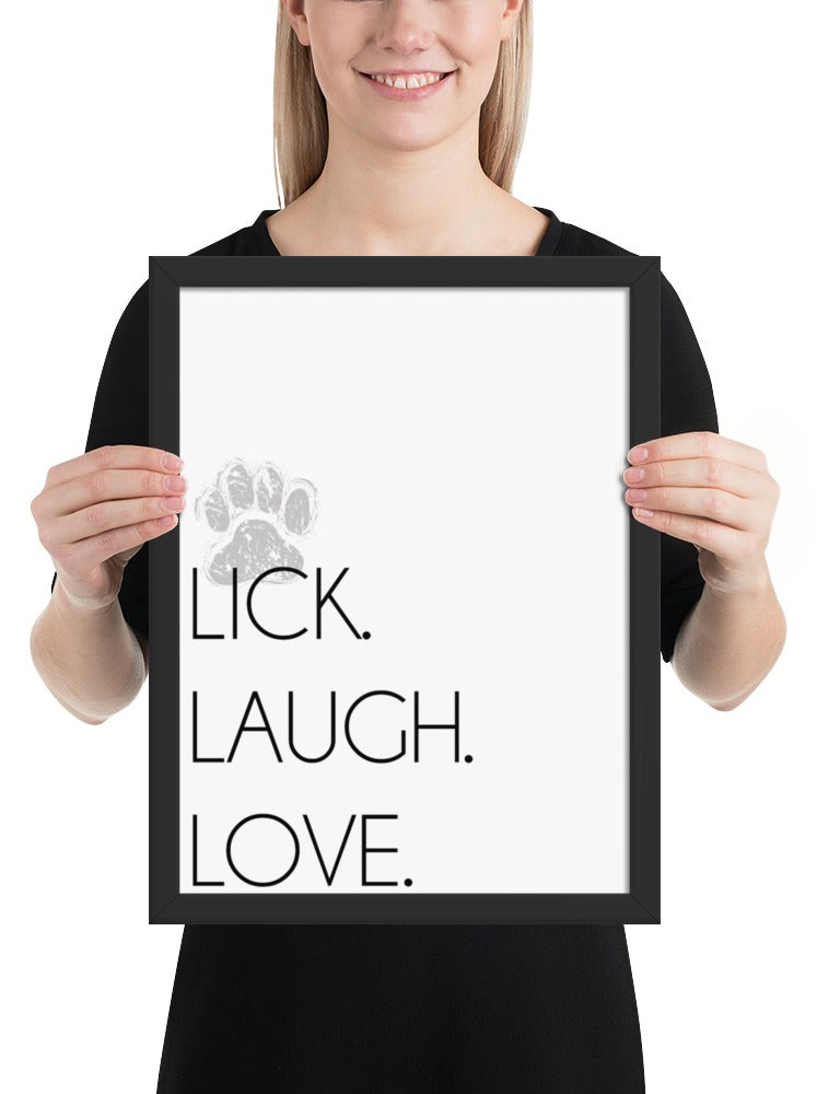 Lick. Love. Laugh. Quote Sign (White / Black Frame): held up to show its size. [ks Background=White; Style=Black Frame; kind=product]