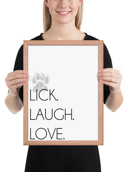 Lick. Love. Laugh. Quote Sign (White / Oak Frame): held up to show its size. [ks Background=White; Style=Oak Frame; kind=product]