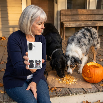 A woman in her 60s with a silver bob and a navy cardigan with a custom pet snap iPhone case (Matte) featuring an illustration of Bella the black Labrador & Storm the Australian Shepherd, with Bella & Storm beside them. [ks Finish=Matte; kind=lifestyle]